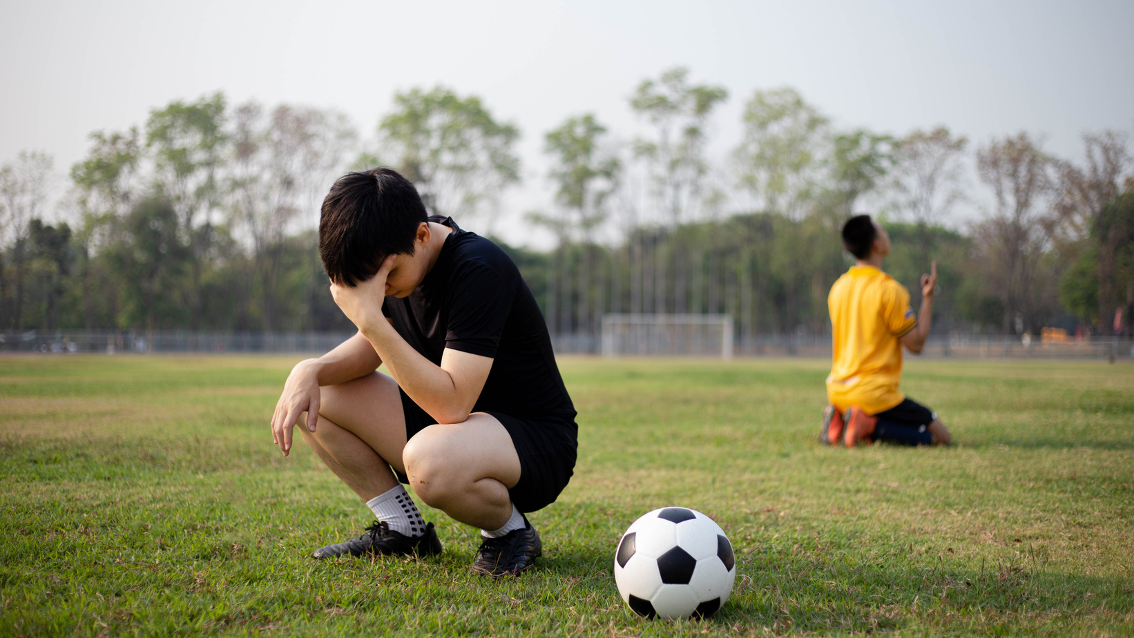 Sad Football Player Defeated in a Match